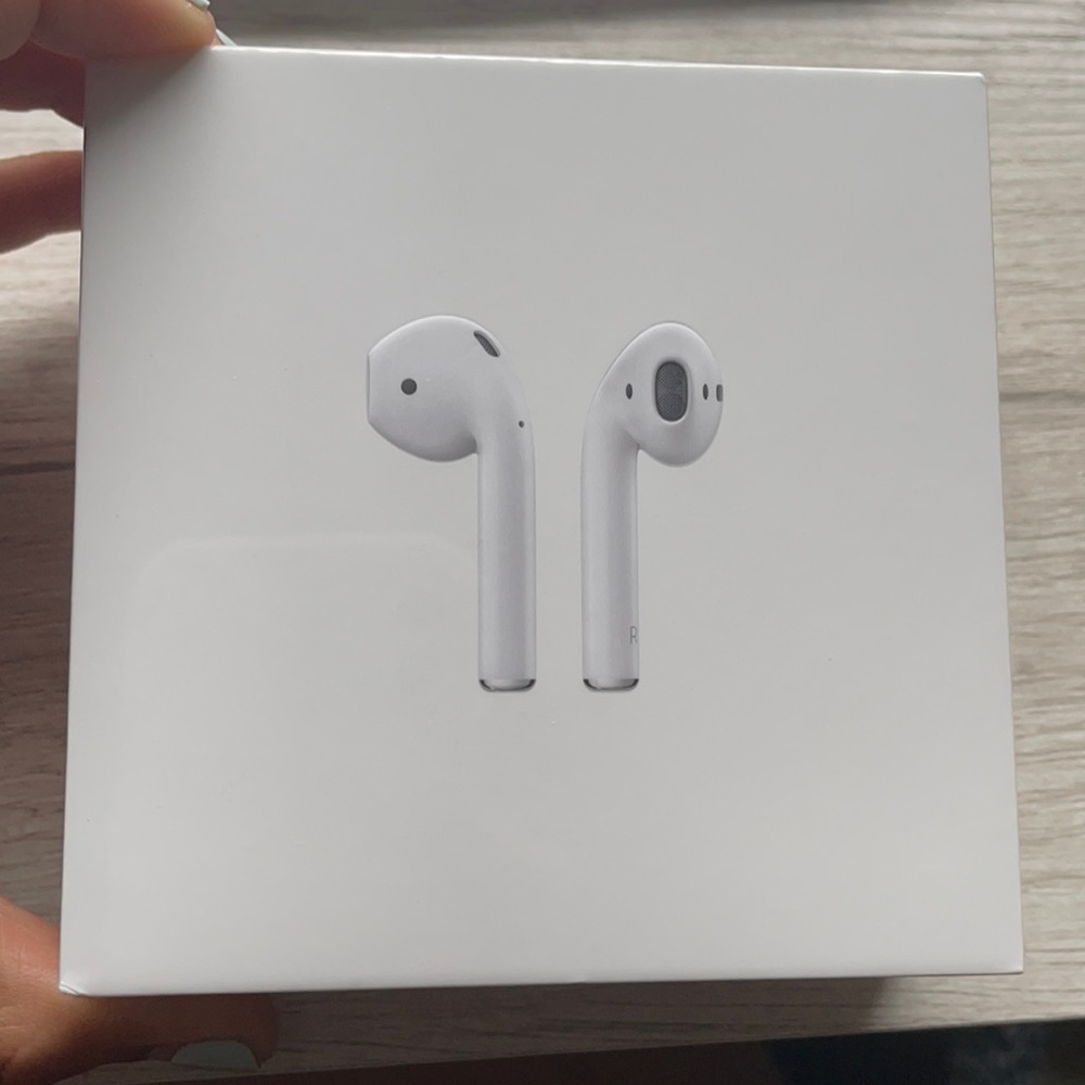 Sealed, brand new AirPods with charging case